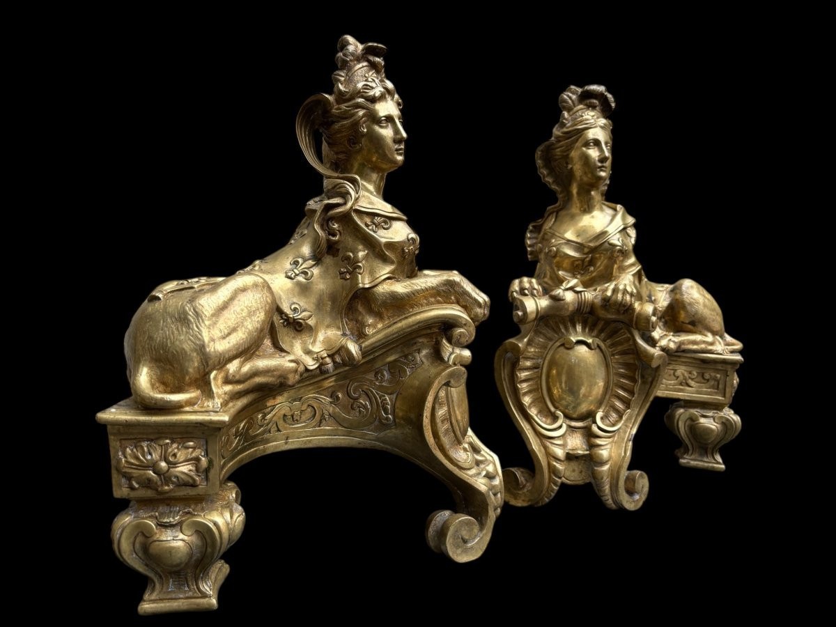 Pair of large Regency bronze ‘Sphinx’ andirons. Beautiful pair of gilt bronze andirons representing sphinxes supported by a coat of arms.Beautiful bronzes, high-quality workmanship, French