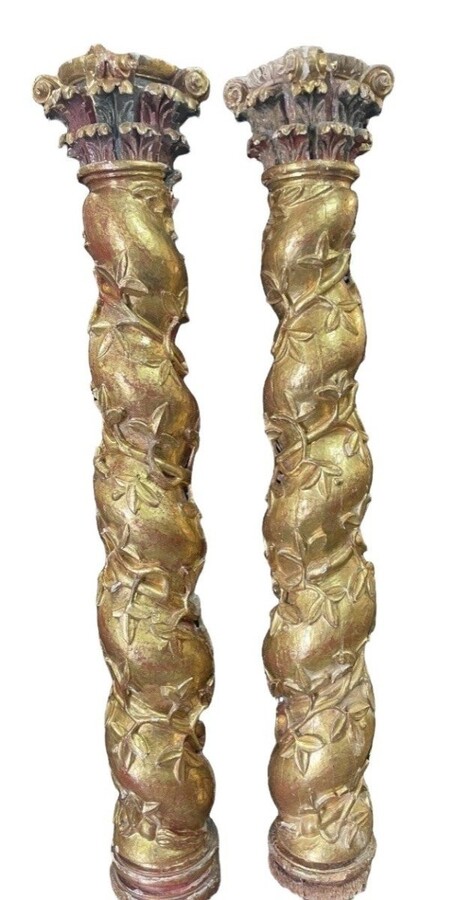 Pair of large twisted columns with capitals early 17th century. Highly decorative gilded wood sculpted columns from the Baroque period in good condition with old traces of woodworm. Dimensions : Height : 191 cm Width : 26 cm Baroque columns from 1650-1680
