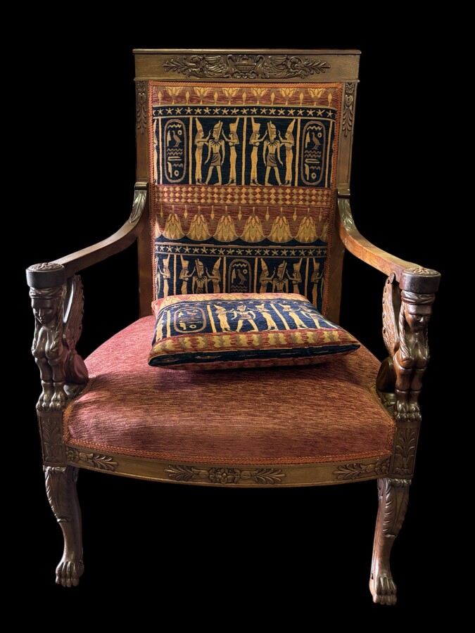 Pair of large walnut armchairs in the 19th century Empire style Armchairs decorated with carved wooden sphinxes and Empire decorations and fitted with a beautiful fabric tapestry and a cushion with Egyptian representations. 