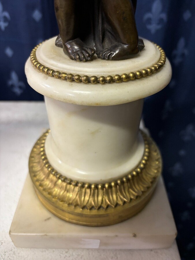 Pair of Napoleon III ‘2 angels’ bronze candelabras. Nice 19thC. candelabra representing a pair of angels carrying 3 gilt bronze candelabra with sprigs of flowers resting on a white marble base.