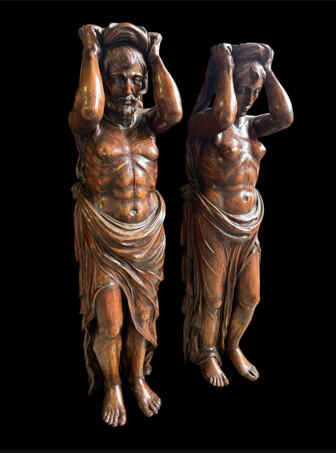 Pair of Renaissance-style sculptures/caryatids in oak, early 19thC. Beautifully carved decorative wooden sculptures representing a female figure and a male figure dressed in robes. Dimensions: Height: 123 cm Width: 31 cm Depth: 28/29 cm In good condition,