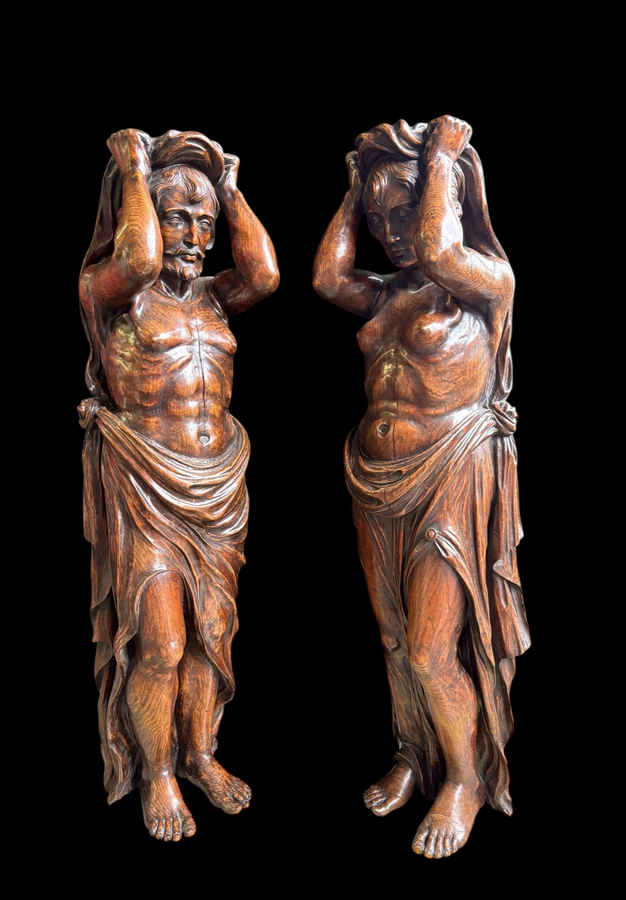 Pair of Renaissance-style sculptures/caryatids in oak, early 19thC. Beautifully carved decorative wooden sculptures representing a female figure and a male figure dressed in robes. Dimensions: Height: 123 cm Width: 31 cm Depth: 28/29 cm In good condition,
