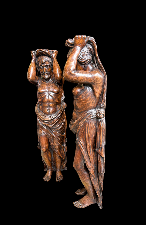 Pair of Renaissance-style sculptures/caryatids in oak, early 19thC. Beautifully carved decorative wooden sculptures representing a female figure and a male figure dressed in robes. Dimensions: Height: 123 cm Width: 31 cm Depth: 28/29 cm In good condition,
