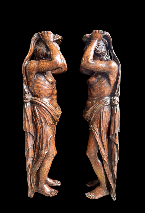 Pair of Renaissance-style sculptures/caryatids in oak, early 19thC. Beautifully carved decorative wooden sculptures representing a female figure and a male figure dressed in robes. Dimensions: Height: 123 cm Width: 31 cm Depth: 28/29 cm In good condition,