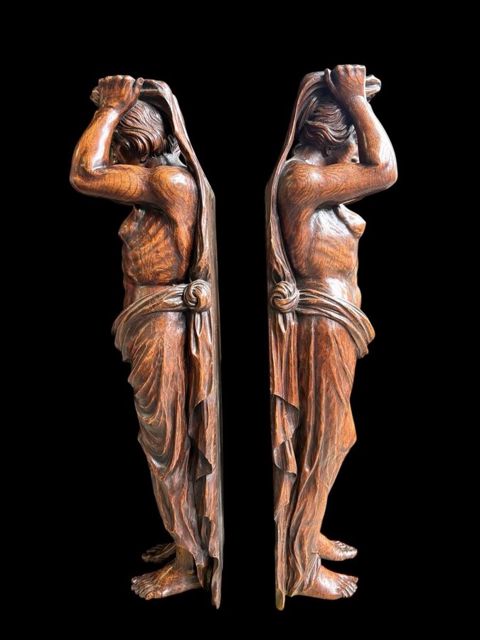 Pair of Renaissance-style sculptures/caryatids in oak, early 19thC. Beautifully carved decorative wooden sculptures representing a female figure and a male figure dressed in robes. Dimensions: Height: 123 cm Width: 31 cm Depth: 28/29 cm In good condition