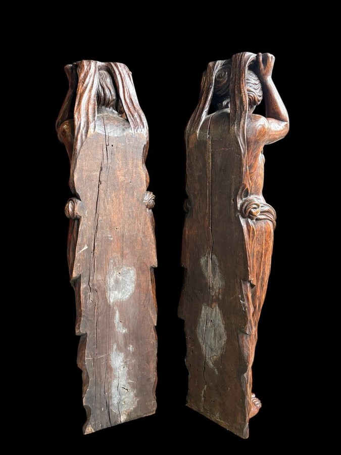 Pair of Renaissance-style sculptures/caryatids in oak, early 19thC. Beautifully carved decorative wooden sculptures representing a female figure and a male figure dressed in robes. Dimensions: Height: 123 cm Width: 31 cm Depth: 28/29 cm In good condition