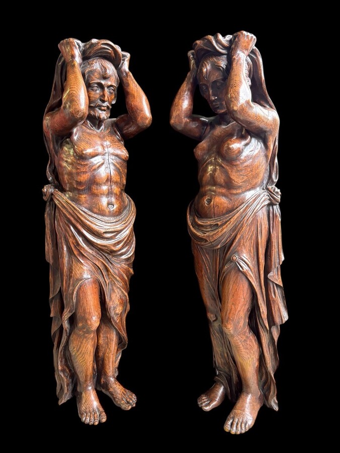 Pair of Renaissance-style sculptures/caryatids in oak, early 19thC. Beautifully carved decorative wooden sculptures representing a female figure and a male figure dressed in robes. Dimensions: Height: 123 cm Width: 31 cm Depth: 28/29 cm In good condition