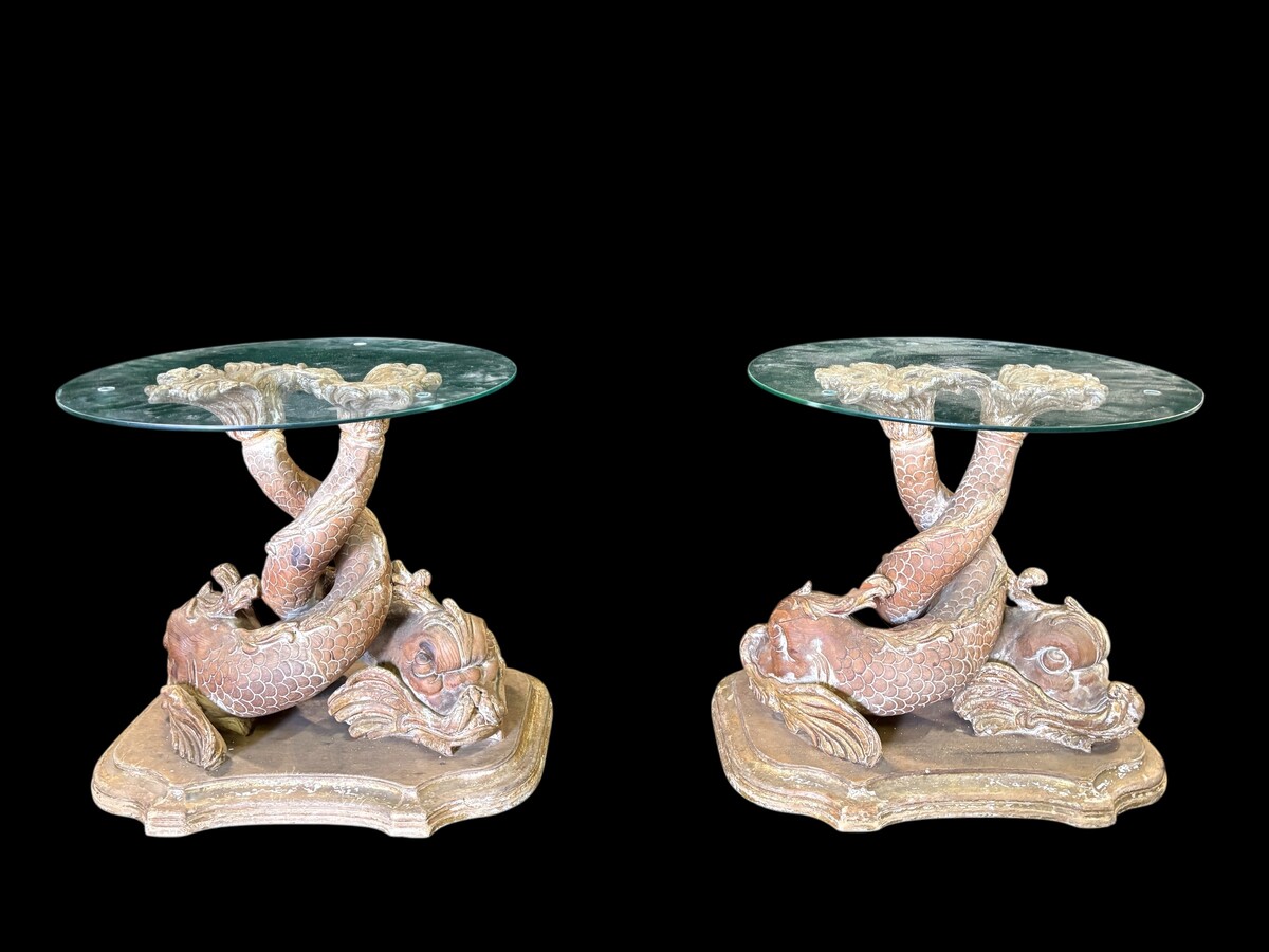 Pair of wooden coffee tables, ‘Mythological Fish,’ late 19th century. Highly decorative coffee tables depicting two intertwined fish, finely carved and featuring a round glass top.In good condition
