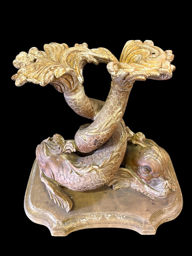 Pair of wooden coffee tables, ‘Mythological Fish,’ late 19th century. Highly decorative coffee tables depicting two intertwined fish, finely carved and featuring a round glass top.In good condition