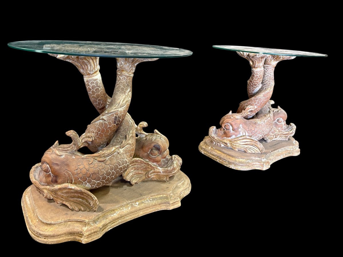 Pair of wooden coffee tables, ‘Mythological Fish,’ late 19th century. Highly decorative coffee tables depicting two intertwined fish, finely carved and featuring a round glass top.In good condition
