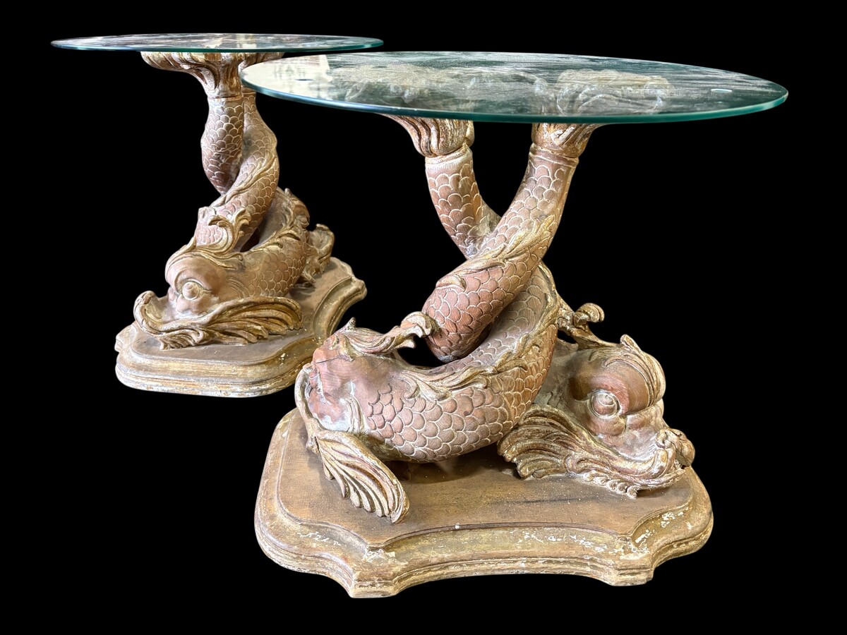 Pair of wooden coffee tables, ‘Mythological Fish,’ late 19th century. Highly decorative coffee tables depicting two intertwined fish, finely carved and featuring a round glass top.In good condition wi