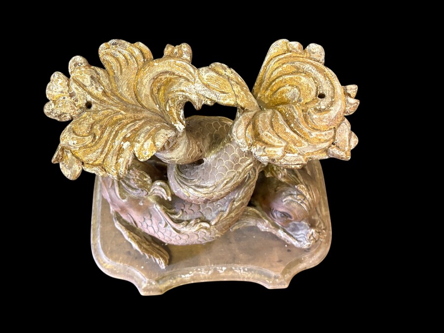 Pair of wooden coffee tables, ‘Mythological Fish,’ late 19th century. Highly decorative coffee tables depicting two intertwined fish, finely carved and featuring a round glass top.In good condition wi