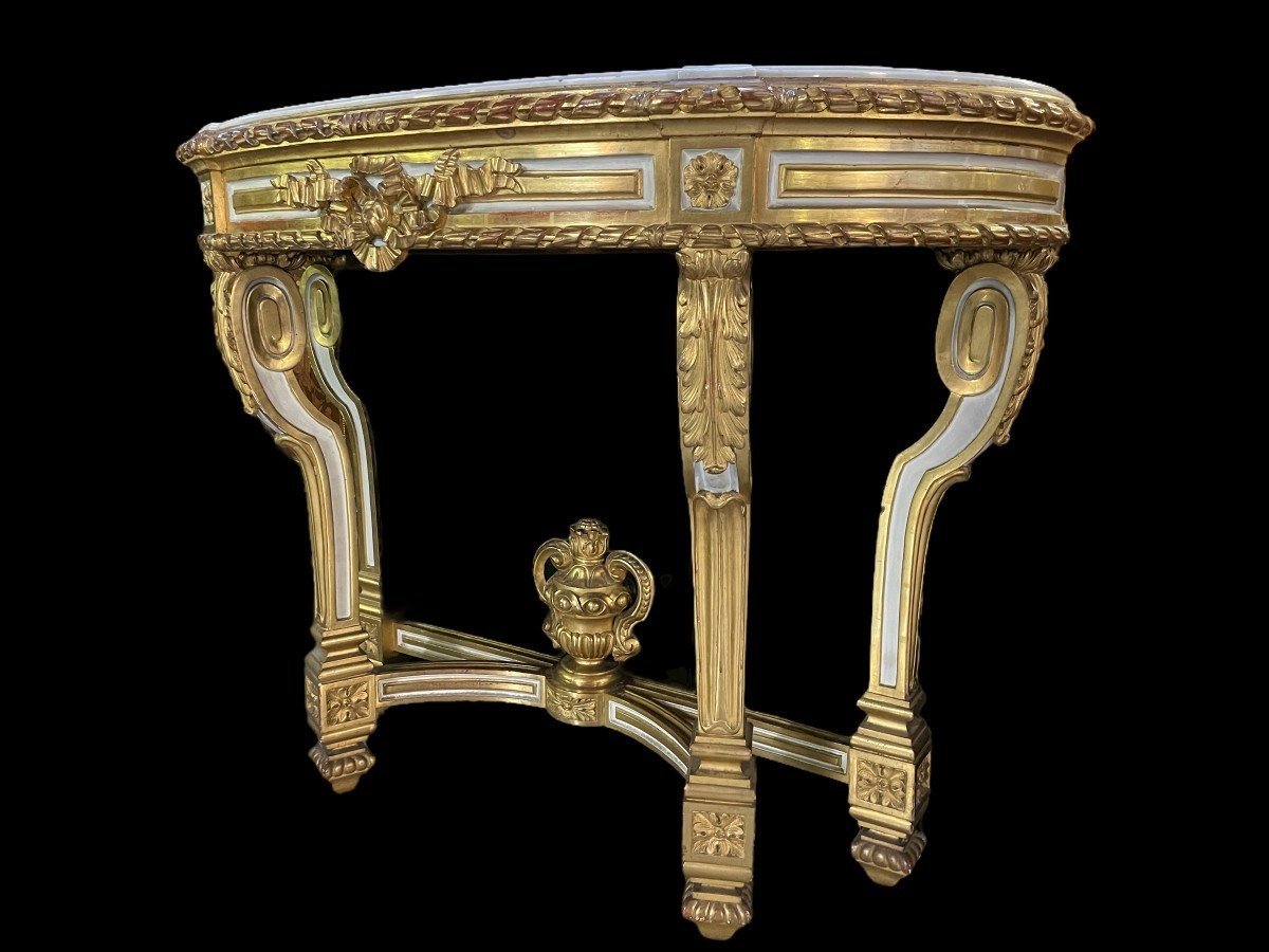 Pretty Louis XVI Style 4-Legged Console In 19th Century Gilded Wood. Decorative Console With White Marble Top And Standing On 4 Legs With A Gilded Ornamental Vase At The Bottom. Console In Good Condition , Missing A Small Piece Of Wood