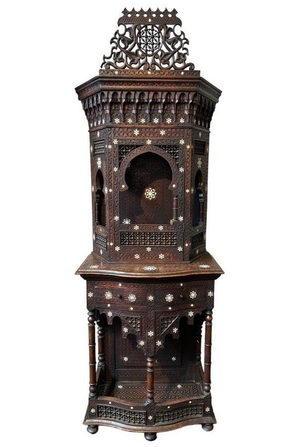 Sculpted furniture with inlays of ebony and mother-of-pearl. Syria , early 19th century. Furniture in used condition , consists of 2 parts with some missing pieces of wood Dimensions : Height : 234 cm Width : 86 cm Depth : 30 / 48 cm