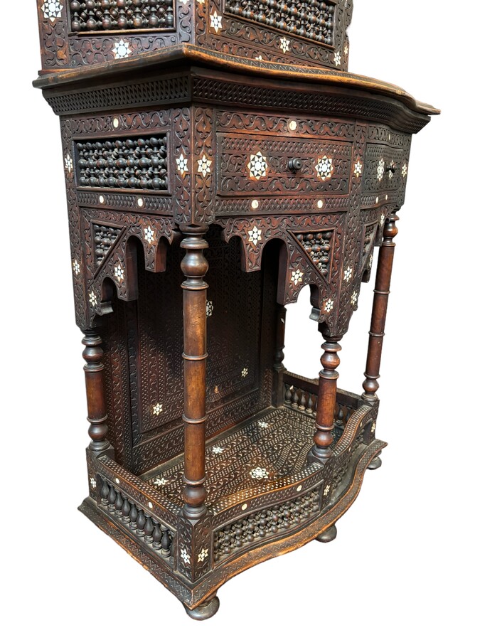 Sculpted furniture with inlays of ebony and mother-of-pearl. Syria , early 19th century. Furniture in used condition , consists of 2 parts with some missing pieces of wood Dimensions : Height : 234 cm Width : 86 cm Depth : 30 / 48 cm Very decorative furni