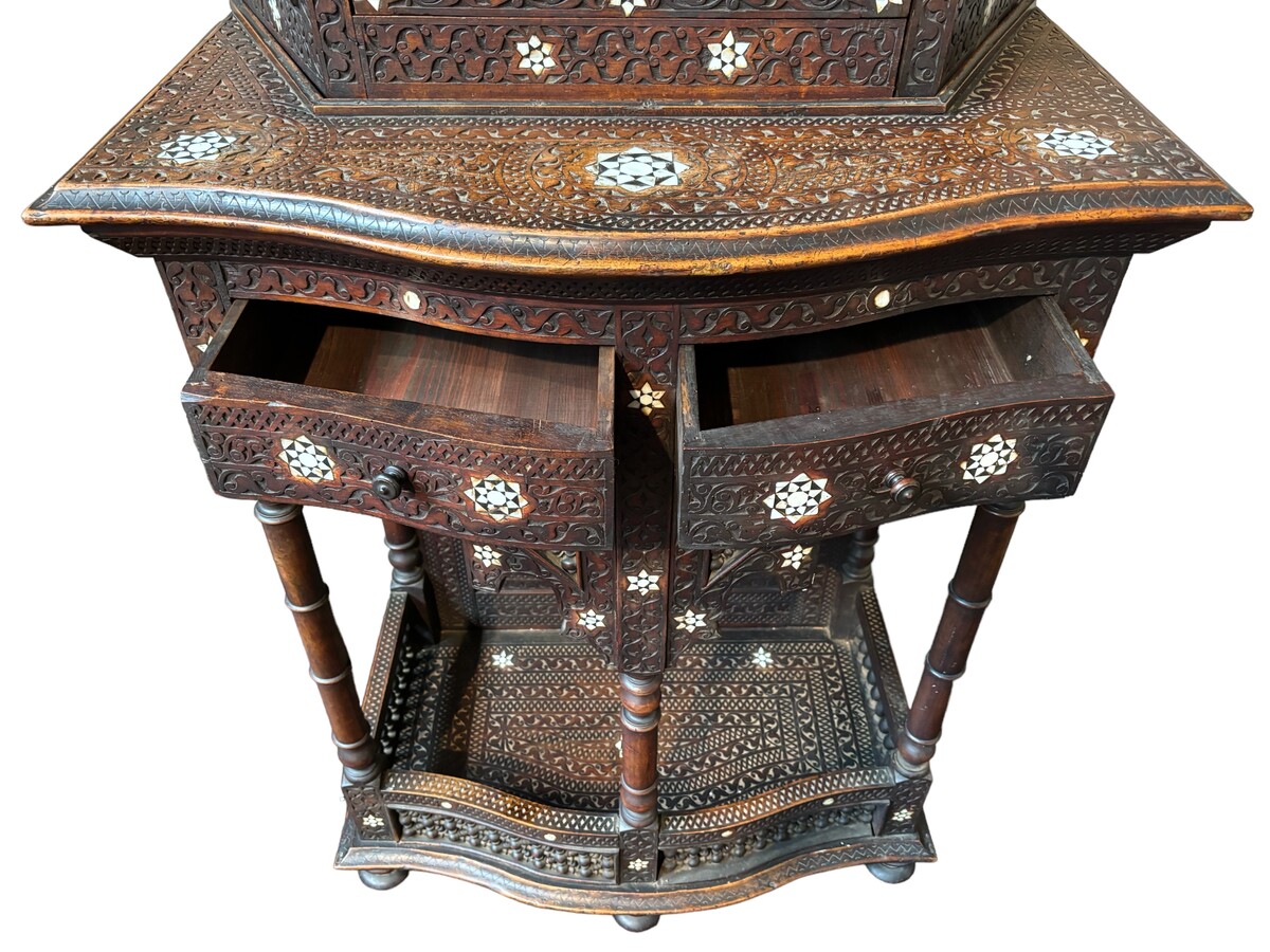 Sculpted furniture with inlays of ebony and mother-of-pearl. Syria , early 19th century. Furniture in used condition , consists of 2 parts with some missing pieces of wood Dimensions : Height : 234 cm Width : 86 cm Depth : 30 / 48 cm Very decorative furni