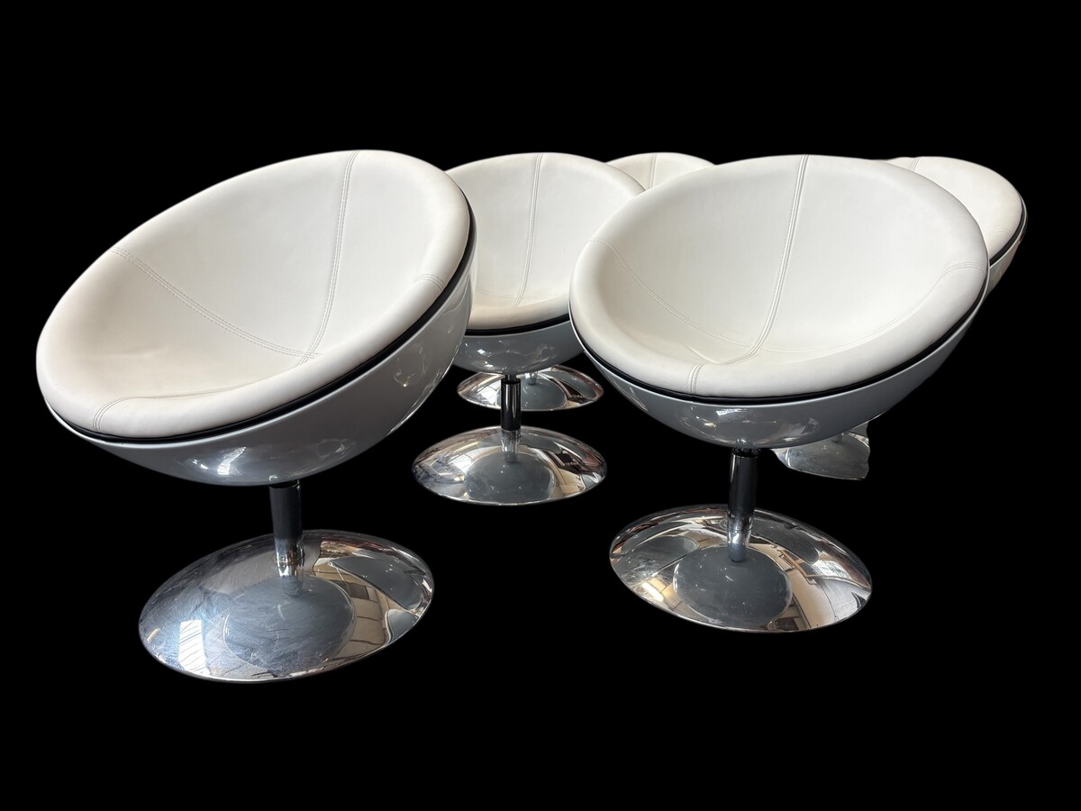 Set of 12 designer chairs in a half-egg shape with coloured polyester frame, chrome metal swivel base and white and black sky upholstery. Late 20th century reproductions based on a model from the 1960s-1970s. In good condition with signs of wear.