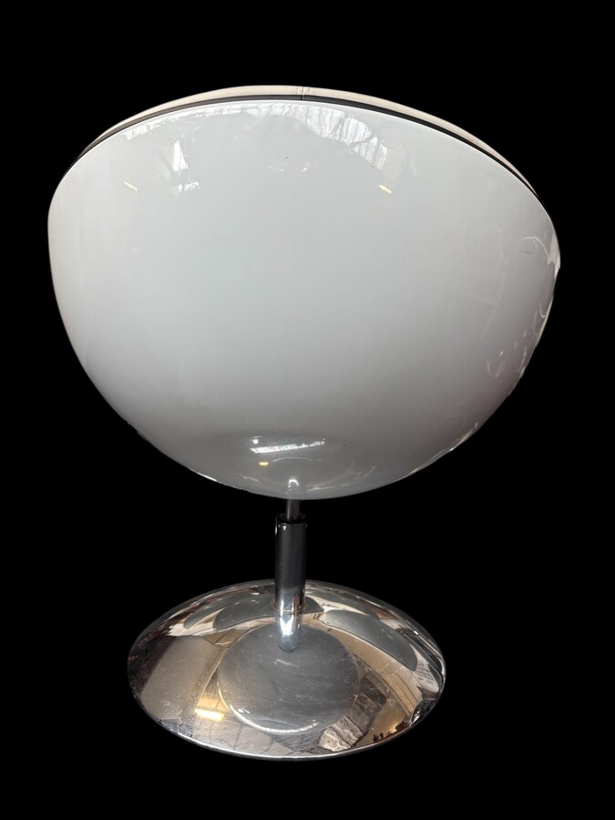 Set of 12 designer chairs in a half-egg shape with coloured polyester frame, chrome metal swivel base and white and black sky upholstery. Late 20th century reproductions based on a model from the 1960s-1970s. In good condition with signs of wear.