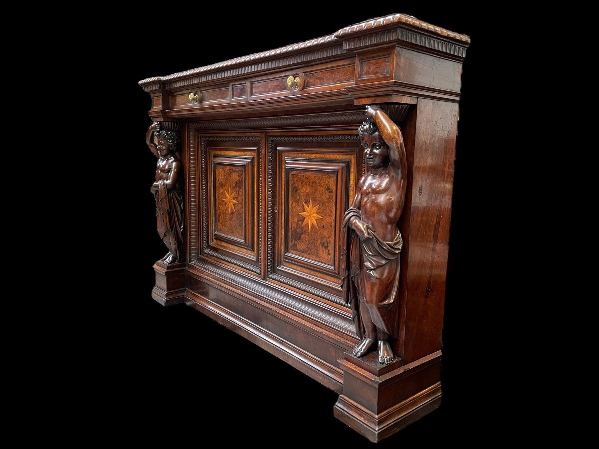 Special cabinet with 2 large sculptures in walnut 19th century. Beautiful cabinet with a distinct shape ( corner ) fitted with 2 doors and 2 drawers , 2 finely carved sculptures and inlaid marquetry in the doors. Locks in the drawers are missing.