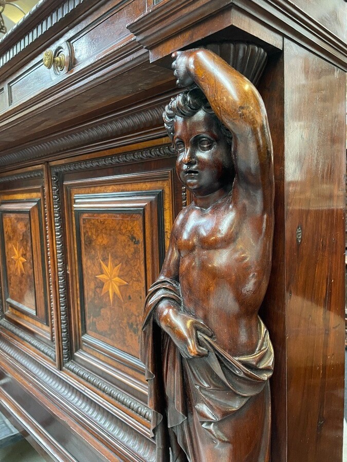 Special cabinet with 2 large sculptures in walnut 19th century. Beautiful cabinet with a distinct shape ( corner ) fitted with 2 doors and 2 drawers , 2 finely carved sculptures and inlaid marquetry in the doors. Locks in the drawers are missing.
