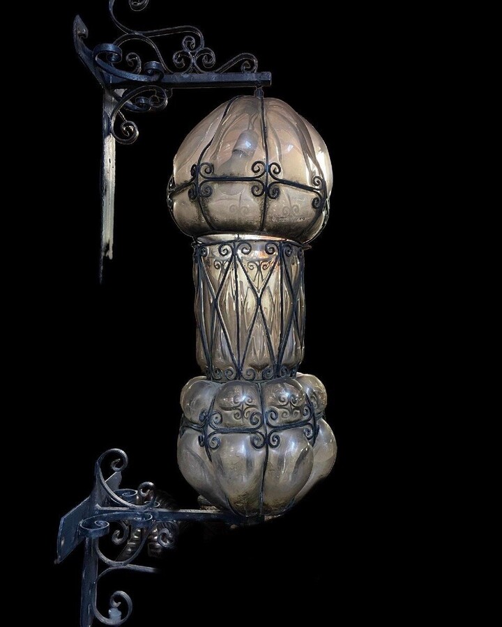 Special large outdoor lamp / lantern in wrought iron and curved glass 1930 ( 126 cm ) Very decorative lantern with curved glass in a wrought iron frame. Lantern needs a small restoration to an iron edge at the top , the glass is in very good condition.