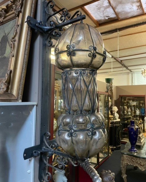 Special large outdoor lamp / lantern in wrought iron and curved glass 1930 ( 126 cm ) Very decorative lantern with curved glass in a wrought iron frame. Lantern needs a small restoration to an iron edge at the top , the glass is in very good condition.