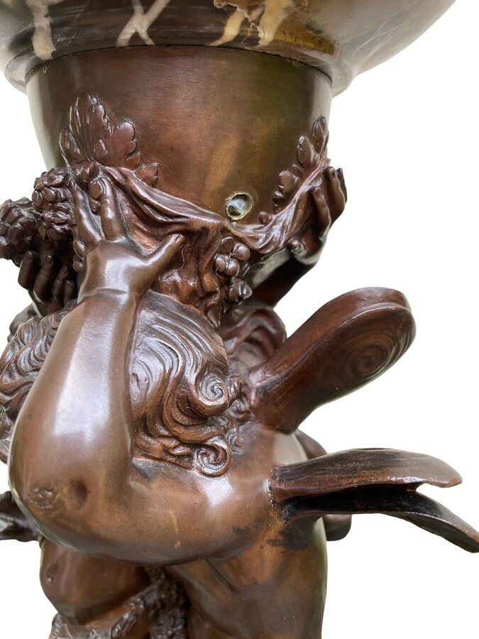 Special Sculpture / centrepiece in bronze by A.Moreau 19th century Very finely detailed Tassa representing a putti and an elf in bronze holding a coupe in marble. The sculpture is in very good condition , has 2 small holes in the bronze under the coupe 