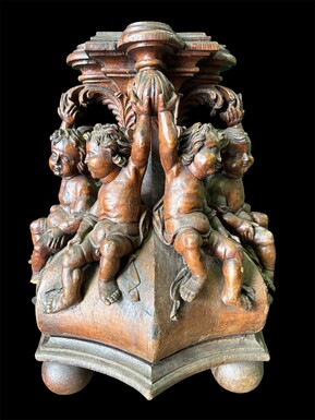 Special stand representing 8 seated Renaissance putti in carved oak, resting on 3 ball feet. Carving and base from the 17th century, top from the 19th century Exceptional 17th century plinth.