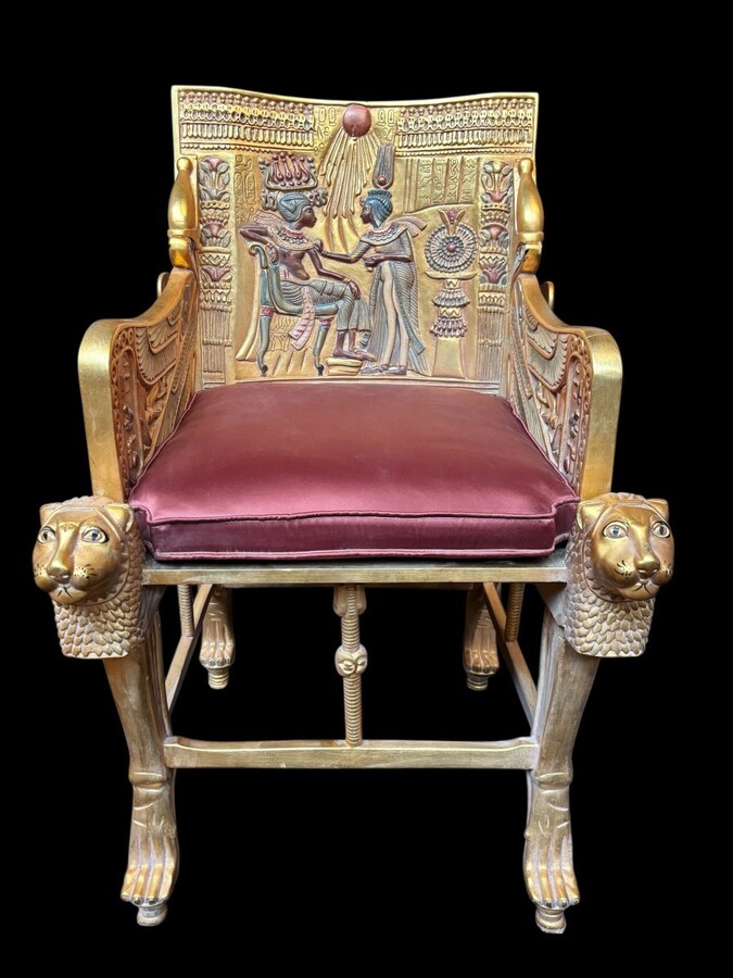 Tutankhamun throne in gilded and patinated wood 21st C. Very decorative gilded wood throne with silk fabric cushion ‘after’ The throne, from the tomb of Tutankhamun.Tutankhamun, pharaoh of ancient Egypt.