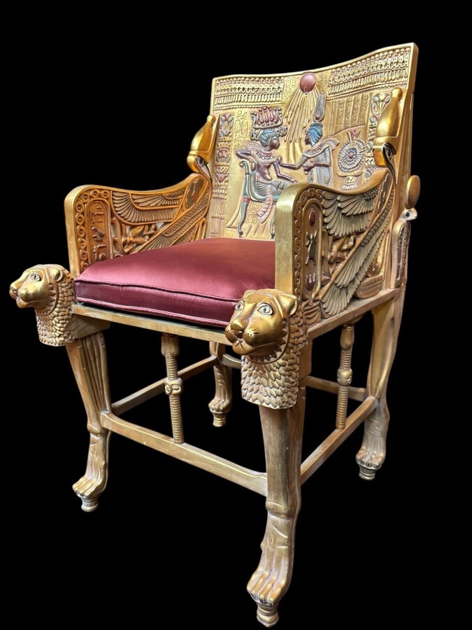 Tutankhamun throne in gilded and patinated wood 21st C. Very decorative gilded wood throne with silk fabric cushion ‘after’ The throne, from the tomb of Tutankhamun.Tutankhamun, pharaoh of ancient Egypt.
