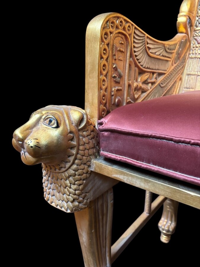 Tutankhamun throne in gilded and patinated wood 21st C. Very decorative gilded wood throne with silk fabric cushion ‘after’ The throne, from the tomb of Tutankhamun.Tutankhamun, pharaoh of ancient Egypt.