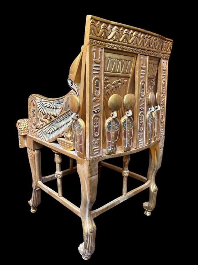 Tutankhamun throne in gilded and patinated wood 21st C. Very decorative gilded wood throne with silk fabric cushion ‘after’ The throne, from the tomb of Tutankhamun.Tutankhamun, pharaoh of ancient Egypt.