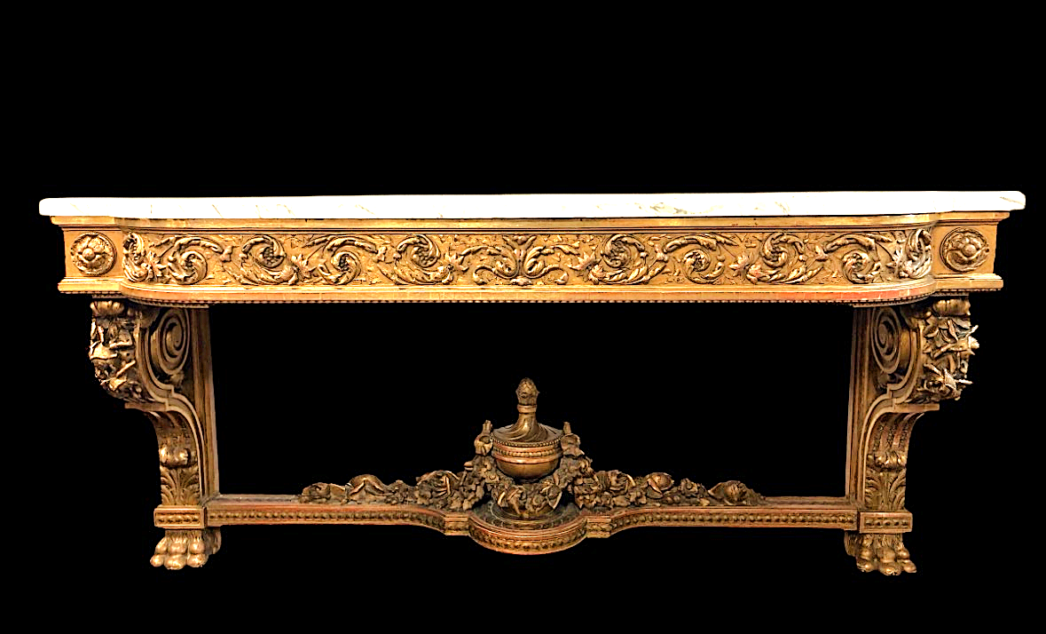 Very large Louis XVI style console table (230 cm) in gilded wood from the 19th century. High-quality console table entirely carved in wood, decorated with gilded motifs, floral scrolls, a large decorative vase in its lower section.