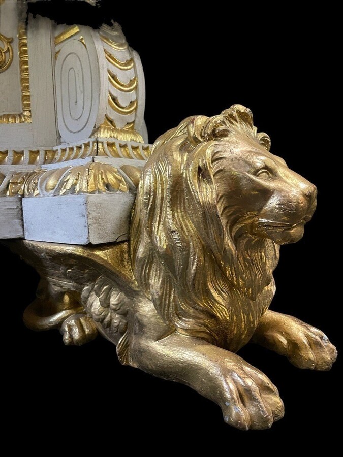 White and Gold Carved Wooden Table With Round Top In Breche d'Alep Marble. A white and gold carved wooden centre table with a round Breche d'Alep marble top resting on a central quadrangular shaft underlined by four inverted consoles and panels.